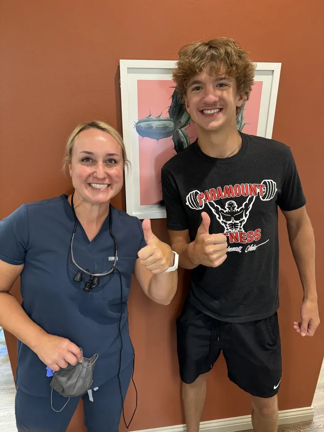 Dr. Oberlander and a patient giving a thumbs up after treatment