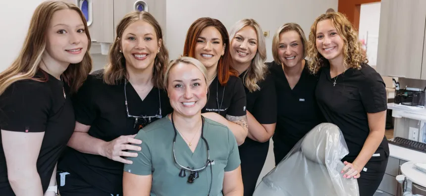 The Cactus Pear Dental team gathered together in a treatment room